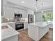 Bright kitchen features stainless appliances, marble countertops, and mosaic backsplash at 120 Generals Pl, Canton, GA 30114
