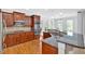 Spacious kitchen with stainless steel appliances, wood cabinets, granite counters, and hardwood floors at 120 Generals Pl, Canton, GA 30114