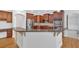 Open concept kitchen with wood cabinets, stainless appliances, granite countertops, and hardwood flooring at 120 Generals Pl, Canton, GA 30114