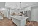 Modern kitchen with a large island, stainless steel appliances, and sleek finishes at 120 Generals Pl, Canton, GA 30114