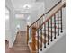Elegant staircase features wood treads and a black wrought iron railing at 120 Generals Pl, Canton, GA 30114