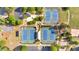 Aerial view of the community tennis courts, surrounded by greenery, parking lot and a gazebo at 120 Generals Pl, Canton, GA 30114