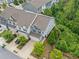 A beautiful home featuring a two-car garage, driveway, and gorgeous yard, as seen from above at 235 Centennial Cir, Canton, GA 30114