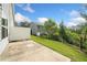 Spacious backyard featuring concrete patio and well-maintained lawn perfect for outdoor entertaining at 235 Centennial Cir, Canton, GA 30114