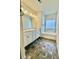 Bright bathroom featuring double vanities, a soaking tub, and decorative tile, providing a spa-like experience at 235 Centennial Cir, Canton, GA 30114