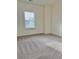 Bright bedroom featuring neutral walls, carpeted floors and a window for natural light at 235 Centennial Cir, Canton, GA 30114