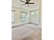 Bright bedroom with neutral carpet, recessed lighting, and multiple windows, offering a serene living space at 235 Centennial Cir, Canton, GA 30114