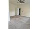 A spacious bedroom features neutral walls, carpeted floors, and a ceiling fan for added comfort at 235 Centennial Cir, Canton, GA 30114