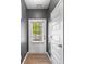 Open entryway with wood floors and view to the exterior at 235 Centennial Cir, Canton, GA 30114