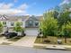 Beautiful two-story home featuring a two-car garage and driveway, and a manicured front yard at 235 Centennial Cir, Canton, GA 30114
