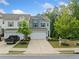 Charming home with a two-car garage, lovely landscaping, and a well-manicured lawn at 235 Centennial Cir, Canton, GA 30114