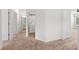 Hallway in a home featuring plush carpeting, white walls, and several doorways at 235 Centennial Cir, Canton, GA 30114