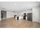 Modern kitchen with stainless steel appliances, peninsula island, and wood floors at 235 Centennial Cir, Canton, GA 30114