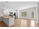Bright kitchen with stainless steel appliances, pantry, and wood-look floors at 235 Centennial Cir, Canton, GA 30114