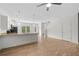 Open floor plan of living room with kitchen area, with wood-look floors at 235 Centennial Cir, Canton, GA 30114