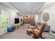 Spacious basement living room with plenty of sunlight, furniture and a bookshelf at 2361 Woodward Nw Way, Atlanta, GA 30305