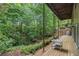 Enjoy the beauty of nature on this expansive wooden deck overlooking a lush forest at 2361 Woodward Nw Way, Atlanta, GA 30305