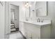 Bathroom featuring double sinks, shaker cabinets, and a large mirror at 2361 Woodward Nw Way, Atlanta, GA 30305