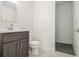 This bathroom showcases a dark vanity, toilet, and a tiled walk-in shower at 2361 Woodward Nw Way, Atlanta, GA 30305