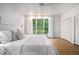 Bedroom featuring a large window view and white closet at 2361 Woodward Nw Way, Atlanta, GA 30305