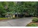 Charming home with lush landscaping and a long driveway leading up to the entrance at 2361 Woodward Nw Way, Atlanta, GA 30305