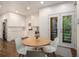 Eat-in kitchen with white cabinets, hardwood floors, and access to back deck at 2361 Woodward Nw Way, Atlanta, GA 30305
