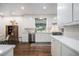 Kitchen offers bright white cabinets, stainless steel appliances, and hardwood floors at 2361 Woodward Nw Way, Atlanta, GA 30305