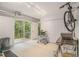 Contemporary living space with sliding glass doors that lead to a deck overlooking the yard at 2361 Woodward Nw Way, Atlanta, GA 30305