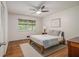 Neutral bedroom with hardwood floors, double windows, and a ceiling fan at 2361 Woodward Nw Way, Atlanta, GA 30305