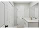 The bathroom has a shower and single sink vanity with white countertop at 3344 Northcrest Rd # A, Atlanta, GA 30340