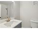 The bathroom features a mirror and single sink vanity with white countertop at 3344 Northcrest Rd # A, Atlanta, GA 30340