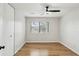 The bedroom has modern ceiling fan, laminate flooring, and a large window at 3344 Northcrest Rd # A, Atlanta, GA 30340
