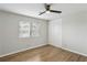 Bedroom featuring a ceiling fan, a window, and bi-fold closet doors at 3344 Northcrest Rd # A, Atlanta, GA 30340