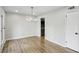Dining area with wood floors, modern lighting, and neutral walls at 3344 Northcrest Rd # A, Atlanta, GA 30340