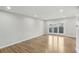 Bright living room with hardwood floors and sliding glass doors at 3344 Northcrest Rd # A, Atlanta, GA 30340