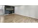 Cozy living room featuring a fireplace, hardwood flooring and freshly painted walls at 3344 Northcrest Rd # A, Atlanta, GA 30340