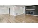 Spacious living room with hardwood floors, fireplace and modern chandelier at 3344 Northcrest Rd # A, Atlanta, GA 30340