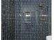Shower features a tiled accent wall, showerhead, and built-in niche at 3344 Northcrest Rd # A, Atlanta, GA 30340