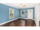 Bedroom featuring hardwood floors, window, and a bright white door at 3378 Lavista Dr, Atlanta, GA 30354