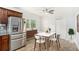 Bright dining area with stainless steel refrigerator, tile flooring, and ample natural light at 3378 Lavista Dr, Atlanta, GA 30354
