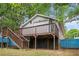 View of the backyard with stairs leading to the house and a wooden deck at 3378 Lavista Dr, Atlanta, GA 30354