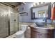 Updated bathroom featuring a glass-enclosed shower, modern fixtures, and sleek vanity at 375 Ralph Mcgill Blvd # 1503, Atlanta, GA 30312