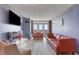 Spacious living room with wood-look tile flooring, modern decor, and balcony access at 375 Ralph Mcgill Blvd # 1503, Atlanta, GA 30312