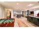 Finished basement boasts modern flooring, a foosball table, pool table, and bar for entertaining and relaxation at 1299 W Wesley Nw Rd, Atlanta, GA 30327
