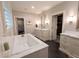 Bathroom boasting a soaking tub, double vanities, and a walk-in shower, ideal for relaxation and convenience at 1299 W Wesley Nw Rd, Atlanta, GA 30327