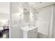 A bright bathroom features white subway tiles in shower and vanity with marble countertop, offering a clean and elegant space at 1299 W Wesley Nw Rd, Atlanta, GA 30327