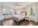 Well-lit bedroom with wood floors, two windows, and an ample amount of natural light at 1299 W Wesley Nw Rd, Atlanta, GA 30327