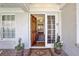 Elegant front door with sidelight, transom, and brickwork entryway leads into a bright, inviting home at 1299 W Wesley Nw Rd, Atlanta, GA 30327