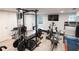 Home gym equipped with various weight training machines, treadmill, and free weights for a complete fitness experience at 1299 W Wesley Nw Rd, Atlanta, GA 30327