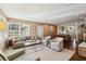 Open concept living area with a fireplace, built-ins, and seamless flow to the kitchen at 1299 W Wesley Nw Rd, Atlanta, GA 30327